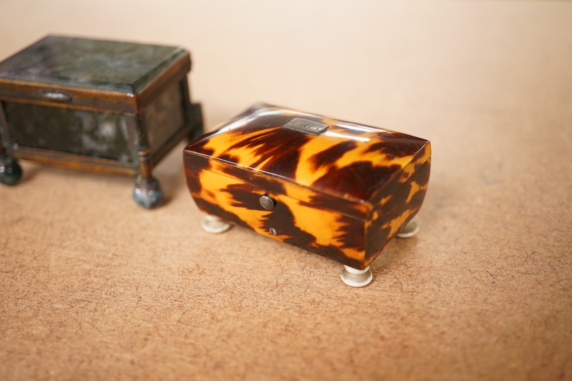 A 19th century miniature brass and agate trinket box and two early 19th century tortoiseshell needle boxes, largest 5.5cm wide x 2.5cm high